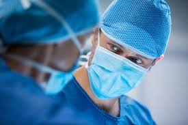 Download Surgeons Interacting While Performing Operation For Free In 2020 Surgeon Free Photos Cancer