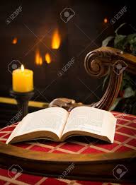 Living room interior with fabric armchair ,lamp,book and plants on empty yellow wall background. James Joyce 1917 Book Open On Chair In Chilly Scene With Fire Stock Photo Picture And Royalty Free Image Image 14946115