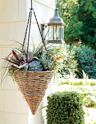 Massive hanging flower basket exploding with purple pink and white flowers. 30 Heat Tolerant Container Gardens For Summer Southern Living