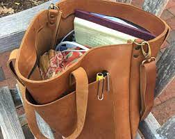 Kate spade camel color leather tote bag , top magnetic closure, gold hardware, leather and chains handles, two compartments with middle zipper pocket, interior zipper pocket. Camel Leather Tote Etsy
