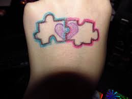 Puzzle heart couple tattoos on wrists. 28 Heart Puzzle Tattoos