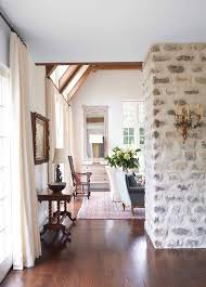 The hearth is deep and practical and the wooden mantle provides further space for implements. Makeover How We Replastered Our Mountain House Stone Fireplace