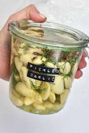 Scrub pickles , wash and sterilize jars , keep jars hot in boiling water , also have brine boiling and ready , pull out 1 jar , quickly pack it with dill , pickles and garlic , pore in boiling brine 1/2 in from top , install sterilized lid and ring. 4jih2eq8w09fmm