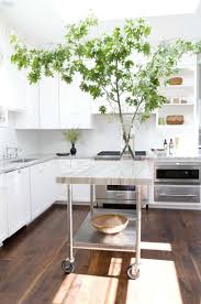 The slatted design of the kitchen island's center shelf is perfect for storing wine bottles, while the solid bottom shelf is ideal for large pots and pans. Marble Top Kitchen Island Cart Ideas On Foter