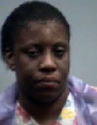 Woman charged in Sanford slaying