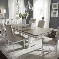 The table is made of solid acacia wood and has a natural dark brown wood grain and chestnut finish. Abbey Park 7 Piece Dining Room Table With 4 Upholstered Side Chairs And 2 Hostess Chairs Bernie Phyl S Furniture By Liberty Furniture