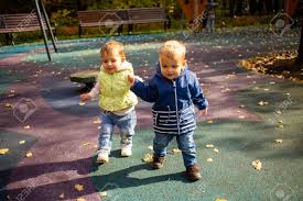 Dinosaurs, diggers, and dump trucks coloring book: Two Cute Toddlers Boy And Girl Walk In The Autumn Park And Hold Hand Friendship Since Childhood Concept Stock Photo Picture And Royalty Free Image Image 151384482