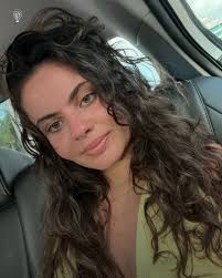 Tia Zakher, a 22-year-old TikTok creator, went viral for following the  "Caveman" skincare routine—avoiding all face washing and products to let  her skin heal naturally. Despite criticism and visible dryness, she remains