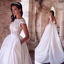 Discount Vintage 2019 White Princess Wedding Dresses With Pockets Lace Appliques Boat Neck Capped Sleeves Backless Bridal Gowns With Sweep Train Cheap Wedding D Lace Top Wedding Dress Wedding Dresses Corset