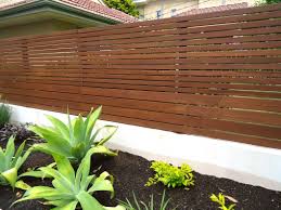 The horizontal railings aren't typical but they just might be the style that works for your home. Pin By Matt Malone On The Yard Horizontal Fence Design Fence Design Horizontal Fence
