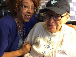 Both caregivers with Visiting Angels and their clients embrace the value of  hugs