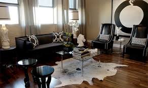 You can go with a smaller rug (like a 5' by 8') that can float in the room in between the furniture, but under the coffee table says. 20 Living Rooms Adorned With Cowhide Rugs Home Design Lover