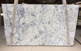 White ice granite has a white background with patches of beige and black that are accompanied by grey speckles. Top Quality White Granite Slabs White Ice Granite Stone Slabs For Countertops Granite Slabs