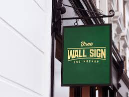 Free Wall Mounted Shop Sign Mockup Psd Sign Mockup Shop Signs Wall Signs
