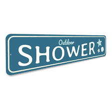 A stunning outdoor bathroom on deck featuring a shower and a charming tub. Outdoor Shower Beach Sign Lizton Sign Shop
