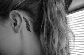 pin by josie bond on in the skin tasteful tattoos feather tattoo behind ear tattoos