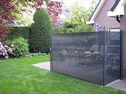 zijwandscherm met omrolmast trendo externo buitenleven windschermen buitentapijten buitengordijnen terrasheat tuin windscherm pergola dak daktuinen