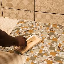Glass mosaic tile can be used far beyond the kitchen and bathroom. Home Dzine Bathrooms Install Glass Mosaics On Shower Floor