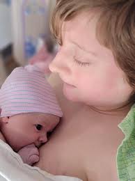 Grandmother babysitting her granddoll Twila