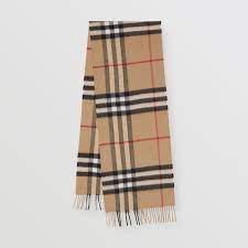 It currently designs and distributes ready to wear including trench coats (for which it is most famous), leather goods, footwear, fashion accessories, eyewear, fragrances, and cosmetics. The Classic Check Cashmere Scarf In Archive Beige Burberry United States