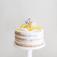 Lavender And Lemon Curd Chiffon Cake Decorated With Dried Lemon Slices Fresh Lavender And Edible Flower Petal Edible Flowers Cake Lavender Cake Chiffon Cake
