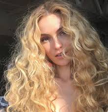 A portrait of a charming young girl with curly fair hair in a yellow dress. Blonde Curls And White Girl Image 6302225 On Favim Com