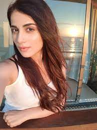Next, she applied a sleek thin line of black eyeliner on her upper lash. Radhika Madan Imdb