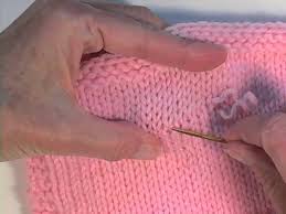 Knitted sweater in drops nord. Fix A Snagged Sweater By Pulling The Yarn Back In