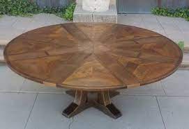 A circular dining table that expands when rotated. Expanding Round Table