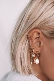 5 reasons to wear mini hoops this summer earings piercings ear jewelry ear piercings