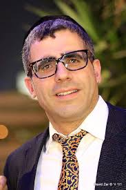 Gavriel Sason, which 7 of his children passed away in a tragic fire a half  year ago, delivered 7 new Sifrei Torahs earlier today in Machne Zikim in  memory of his children.