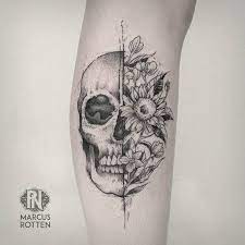Chest tattoo of skull in flower with straight razoe and lettering. 60 Best Skull Tattoo Designs And Ideas Floral Skull Tattoos Skull Tattoo Design Skull Tattoo Flowers