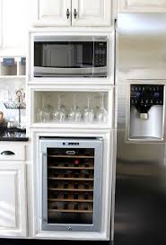 Using Old Wall Oven Cabinet For Microwave And Mini Fridge For The Little Kids Instead Of The Wine Cooler Kitchen Design Small Kitchen Design Kitchen Solutions