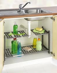 Une Etagere Reglable Telescopique Qui S Adapte Facilement A L Espace Du Placard Sous Evi En 2020 Amenagement Petite Cuisine Etagere Sous Evier Astuce Rangement Cuisine