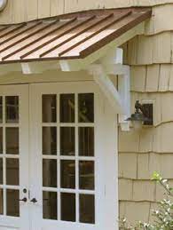 Metal Awning Brackets Google Search House Exterior Standing Seam Metal Roof Door Overhang
