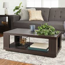 Place lamps, display photos, and incorporate storage by adding a coffee and side tables to a sofa or couch. Whalen
