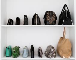 Continuing making this bag chain with all of your bags, and then roll your bags the long way, leaving the handle of the first bag sticking out. 20 Genius Purse Organization Ideas Closetful Of Clothes