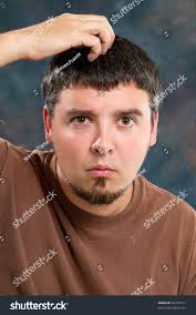 Man Scratches Top His Head Has Stock Photo 56736511