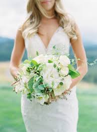 Many celebrities choose to carry a bouquet of white roses on their wedding day. A Beautiful Blue And Cream Mountain Wedding At Suncadia Resort Wedding Wedding Classic Mountain Wedding