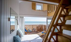 Bournemouth beach lodges are comprised of a stylish open plan space for up to four adults, two children and in some cases, two dogs! Hut Stuff Bournemouth S New Beach Lodges Bournemouth Holidays The Guardian