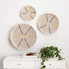 Choose boldly patterned pillows or opt for solid color pillows to draw out a specific color in a painting or rug. Graphic Wall Basket Set