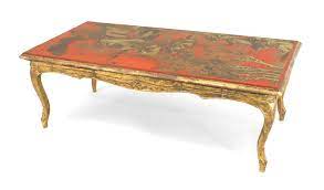 On each leg you can also find a hand painted phoenix. French Louis Xv Red Lacquered Chinoiserie Coffee Table