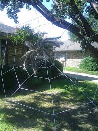 Do It Yourself Giant Spider Web Using Clothesline Rope Easier Than You D Think Halloween Outside Halloween Haunt Halloween Outdoor Decorations