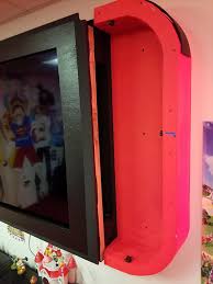 Ce Fan De Nintendo Fabrique Une Switch Geante Pour Son Salon Golem13 Fr Golem13 Fr Design De Salle De Jeux Jeu Video Chambre Cadre Tv