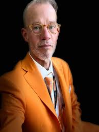 Sitting in the dark (a pre-performance ritual) and thinking how grateful I  am, despite being over the hill, that I am afforded the privilege of  singing our national anthem during football season.