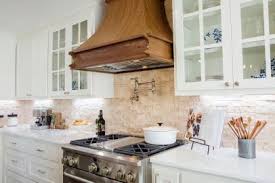 Custom shiplap wood hood for nancy. Renovated Kitchen With Natural Stone Backsplash And Wood Range Hood Hgtv