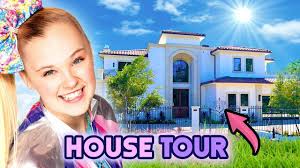 According to buzzfeed , there's still candy in every room , and as you can see, jojo's favorite glittery outfits still adorn the front foyer. Jojo Siwa House Tour 2020 Her New La Mansion Youtube