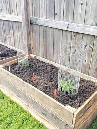 I really like this diy tutorial. How To Build Raised Garden Beds From Wood Pallets Everyday Shortcuts