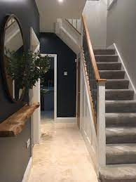 Not only do they offer convenient lighting for any space, but they're also easy to move around so you can make any corner of your home immediately cosier. Dark Blue And Grey Entrance Hall Bronze Round Mirror With A Floating Oak Shelf Hallwayideas House Entrance Hallway Design Hallway Flooring
