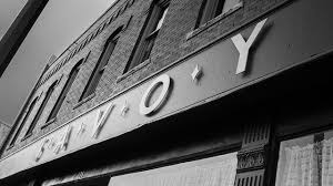 View of the savoy ballroom's neon marquee at night in harlem, new york city. A Brief Introduction To Savoy Walk Blues And Jazz Dance Book Club